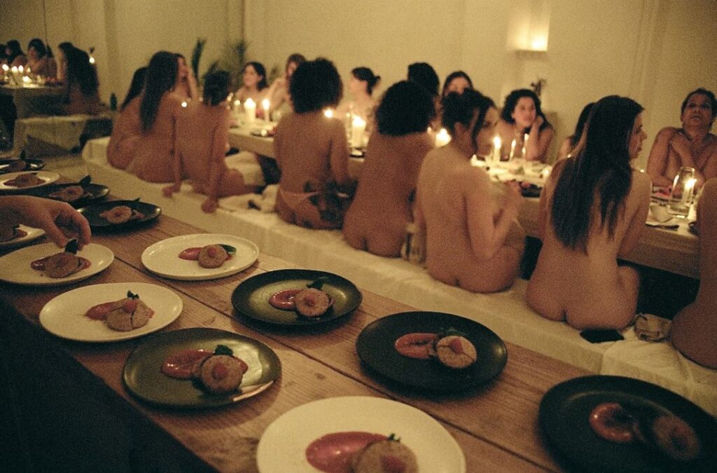 Nudist group eating